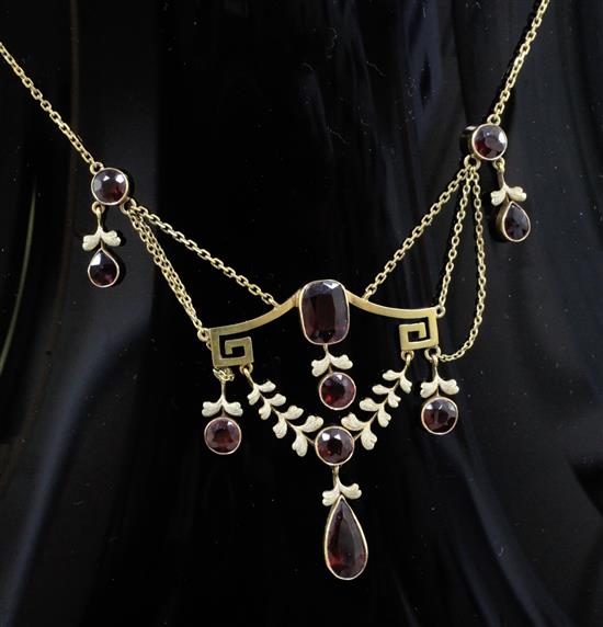 An early 20th century continental gold and garnet set drop necklace, approx. 48cm.